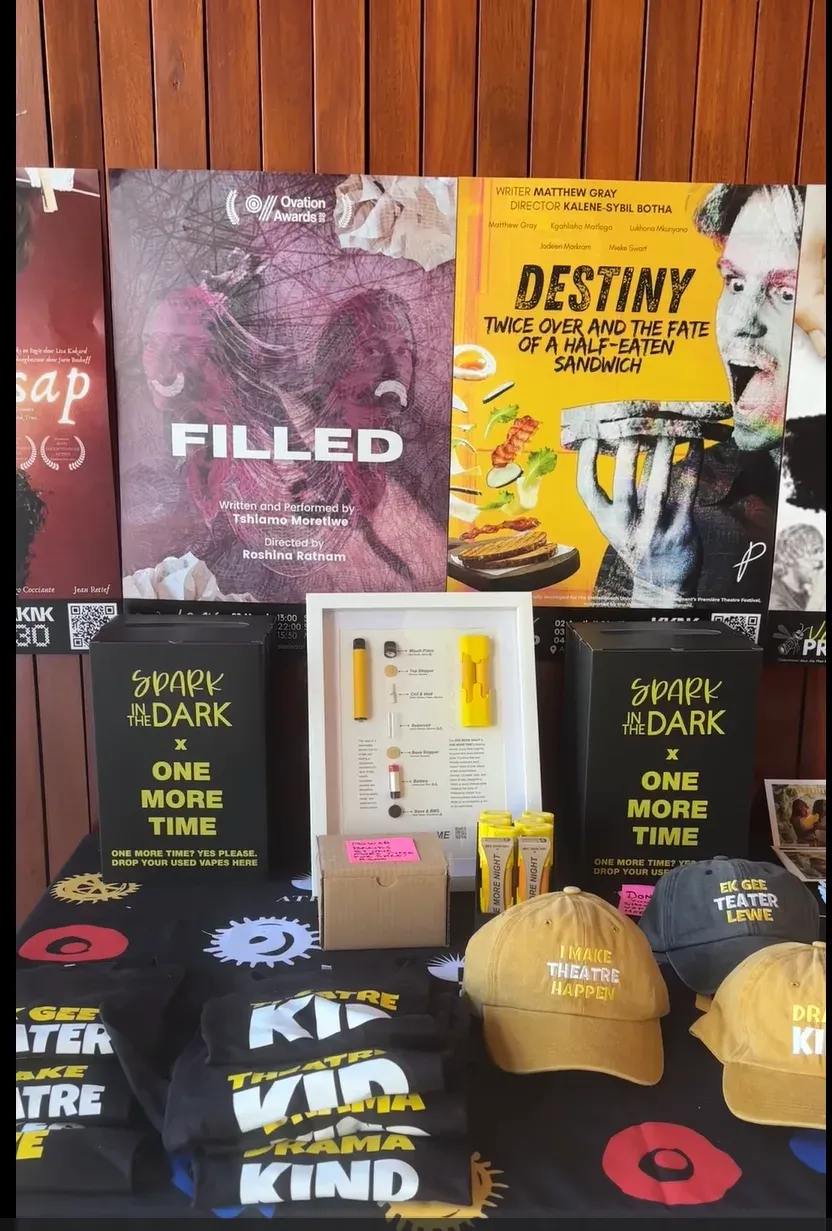 Merchandise and vape donation display with One More Time and Spark in the Dark logo on it. 